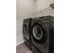 Modern laundry room features updated washer and dryer at 238 Dorothy Ln, Lawrenceville, GA 30046