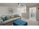Bright living room boasts neutral walls, plush seating, and a ceiling fan for optimal comfort at 238 Dorothy Ln, Lawrenceville, GA 30046