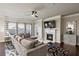 Cozy living room features a fireplace, large windows, and neutral decor at 238 Dorothy Ln, Lawrenceville, GA 30046
