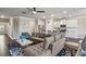 Bright, open-concept living area featuring hardwood floors, modern furnishings, and an adjacent kitchen with white cabinetry at 238 Dorothy Ln, Lawrenceville, GA 30046