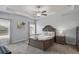 Spacious main bedroom featuring a tray ceiling, ceiling fan, and neutral decor at 238 Dorothy Ln, Lawrenceville, GA 30046