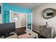 Bright office space featuring a modern desk setup, complemented by a unique accent wall and contemporary decor at 238 Dorothy Ln, Lawrenceville, GA 30046