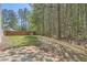 Spacious backyard with a patio and a wooden fence separating the yard from the woods at 2939 Owens Point Nw Trl, Kennesaw, GA 30152
