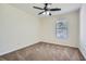 Neutral bedroom with a window allowing natural light, and a ceiling fan with lights at 2939 Owens Point Nw Trl, Kennesaw, GA 30152