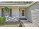 Inviting front porch entrance with hanging plants and decorative shutters at 2939 Owens Point Nw Trl, Kennesaw, GA 30152