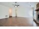 Spacious open-concept living room with wood-look floors and stone fireplace at 2939 Owens Point Nw Trl, Kennesaw, GA 30152