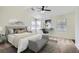 Stylishly furnished bedroom features a large bed, a desk, and large windows at 2939 Owens Point Nw Trl, Kennesaw, GA 30152