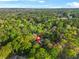 Stunning aerial view of a lush property surrounded by trees and foliage, offering privacy and natural beauty at 315 Mossy Pointe, Duluth, GA 30097