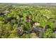 An aerial view highlighting the home and neighborhood surrounded by lush, mature trees at 315 Mossy Pointe, Duluth, GA 30097