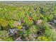 Aerial view of a home nestled among dense trees within a serene residential neighborhood at 315 Mossy Pointe, Duluth, GA 30097