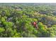 An aerial view of a home nestled among dense trees within a serene residential neighborhood at 315 Mossy Pointe, Duluth, GA 30097