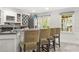 A stylish basement bar is equipped with modern appliances, ample seating, and a wine rack for entertainment at 315 Mossy Pointe, Duluth, GA 30097