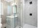 Modern bathroom featuring a glass-enclosed shower, sleek vanity, and contemporary fixtures for a luxurious experience at 315 Mossy Pointe, Duluth, GA 30097