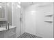 Bathroom showcasing a glass shower with black and white tile, modern fixtures, and a stylish vanity at 315 Mossy Pointe, Duluth, GA 30097