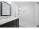 Elegant bathroom featuring a glass-enclosed shower, patterned tile, and a marble vanity at 315 Mossy Pointe, Duluth, GA 30097