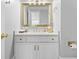 Bright bathroom with marble countertop, white vanity, and gold accents at 315 Mossy Pointe, Duluth, GA 30097