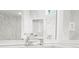 Bathroom with a mirrored wall, marble countertop, and chrome fixtures at 315 Mossy Pointe, Duluth, GA 30097