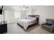 Bright bedroom featuring neutral walls, natural light from windows, and comfortable furnishings for a relaxing retreat at 315 Mossy Pointe, Duluth, GA 30097