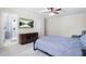 This bedroom features neutral colors, a ceiling fan, and an adjacent bathroom with a glass shower at 315 Mossy Pointe, Duluth, GA 30097