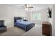 Spacious bedroom with carpeted floors, crown molding, and natural light from a window at 315 Mossy Pointe, Duluth, GA 30097