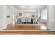 Formal dining room with wainscotting, hardwood floors, a modern chandelier, and natural light at 315 Mossy Pointe, Duluth, GA 30097