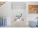 An elegant foyer with marble flooring, art, and a view into the living room with ample natural light at 315 Mossy Pointe, Duluth, GA 30097