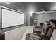 A luxurious home theater features a large screen, plush seating, and a starry night ceiling for an immersive viewing experience at 315 Mossy Pointe, Duluth, GA 30097