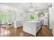 Gourmet kitchen featuring marble countertops, stainless steel appliances, and hardwood floors at 315 Mossy Pointe, Duluth, GA 30097