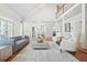 Spacious and bright living room with high ceilings, hardwood floors, and access to outdoor spaces at 315 Mossy Pointe, Duluth, GA 30097