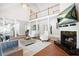 Bright living room with fireplace, soaring ceilings, and a view of the upper level at 315 Mossy Pointe, Duluth, GA 30097