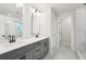 Bathroom features a double sink vanity with quartz countertops and modern fixtures at 4785 Marjorie Dr, Cumming, GA 30041