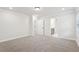 Spacious bedroom features neutral carpet, recessed lighting and ensuite bathroom access at 4785 Marjorie Dr, Cumming, GA 30041