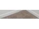 Close-up on professionally installed carpet and trimmed baseboards. Newly installed and clean at 4785 Marjorie Dr, Cumming, GA 30041