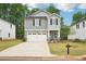Charming two-story home with a manicured front yard and inviting curb appeal in a neighborhood at 4785 Marjorie Dr, Cumming, GA 30041
