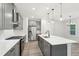 Open concept kitchen with stainless steel appliances and view to living room and breakfast room at 4785 Marjorie Dr, Cumming, GA 30041