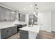 Gourmet kitchen with gray cabinets, stainless steel appliances, and a large center island at 4785 Marjorie Dr, Cumming, GA 30041