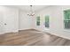 Beautiful living room with hardwood floors, large windows and a glass patio door at 4785 Marjorie Dr, Cumming, GA 30041