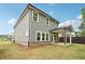 Backyard view of home showing siding, covered patio, and manicured lawn at 4785 Marjorie Dr, Cumming, GA 30041