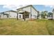 Spacious backyard featuring a covered patio, perfect for outdoor living and entertaining at 4830 Marjorie Dr, Cumming, GA 30041