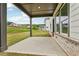 Covered patio featuring a seeded lawn, providing an ideal space for outdoor enjoyment at 4830 Marjorie Dr, Cumming, GA 30041