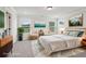 Bright staged bedroom showcasing a comfortable bed, stylish furnishings, and relaxing decor at 4830 Marjorie Dr, Cumming, GA 30041