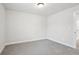 Comfortable bedroom with soft carpet, neutral walls, and a ceiling light at 4830 Marjorie Dr, Cumming, GA 30041