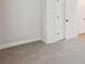 Bedroom with neutral carpet, base trim and doors at 4830 Marjorie Dr, Cumming, GA 30041