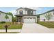Charming two-story home features a well-manicured lawn and a two-car garage at 4830 Marjorie Dr, Cumming, GA 30041
