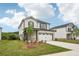 Beautiful two-story home boasts a manicured lawn, two-car garage, and inviting curb appeal at 4830 Marjorie Dr, Cumming, GA 30041