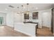 Gourmet kitchen with stainless steel appliances, island with seating, and pendant lighting at 4830 Marjorie Dr, Cumming, GA 30041