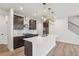 Modern kitchen featuring an island, stainless steel appliances, and pendant lights at 4830 Marjorie Dr, Cumming, GA 30041