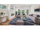 Staged living room features hardwood floors, fire place and neutral colors at 4830 Marjorie Dr, Cumming, GA 30041