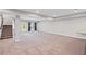 Open basement area with carpet, a staircase, and a glass door leading outside at 5153 Elkins Ln, Acworth, GA 30101