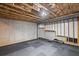 Unfinished basement with exposed ceiling, concrete walls, and rubber flooring at 5153 Elkins Ln, Acworth, GA 30101